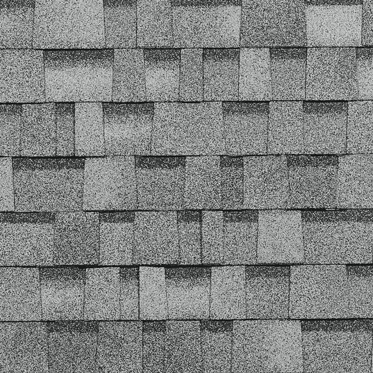 Close-up of Oakridge 32.8 sq. ft. Laminated Roof Shingles - Sierra Gray by Go Build, The Fastest Way To Build, arranged horizontally to showcase the shingle’s texture and grain.